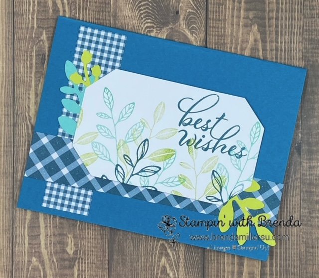 Layering leaves stamp set used to stamp in shades of blue and green on white octagon center focal point with bough punches in background and gingham accents