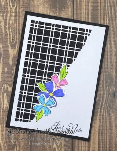 Black notecard with white split solid and checkered for background and blue ,pink and purple flowers with green leaves and Just a Note message
