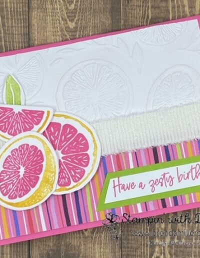 Pink card with Sweet Citrus fruit slices embossed on white and pink/purple/green/yellow stripes on bottom of card. Pink grapefruit slices layered on top with a zesty birthday message.