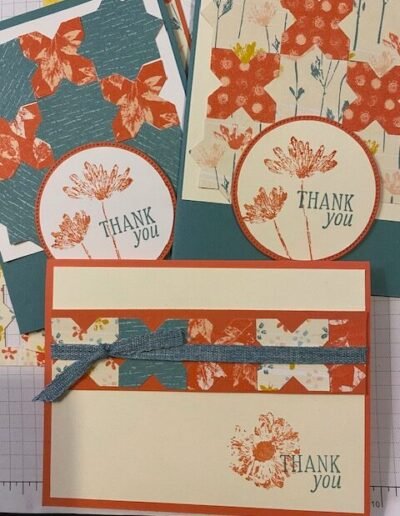 three inked botanicals cards made with lost lagoon and calypso coral inks and card stock with a flower stamp and thank you sentiment