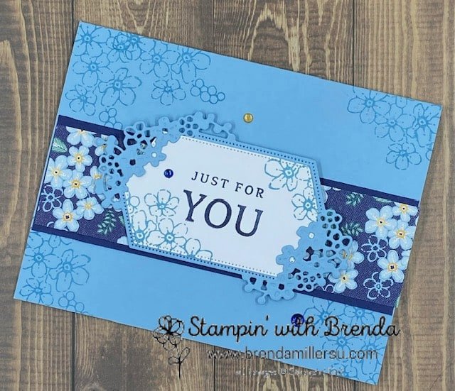 Balmy Blue card with sentimental park flowers in navy and blue and a floral tag saying Just for You