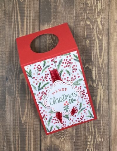 Bottle tag in Real Red with green and red berry leaves and Merry Christmas sentiment made with handmade wishes bundle