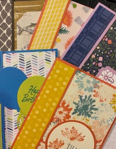 pile of greeting cards using designer series papers (DSP) in a variety of colors and patterns