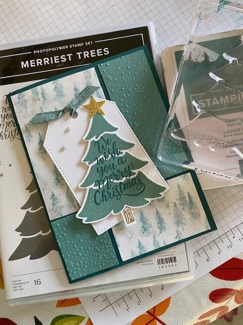 Merriest Trees bundle made tree die cut with We wish you a merry christmas sentiment on it. Lost Lagoon and Pretty Peacock used along with Winter Garden DSP