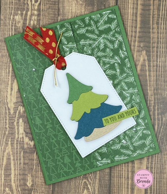 A Walk in the Forest DSP card in shades of green with a layered tree from Merriest Trees and a to you and yours sentiment for christmas