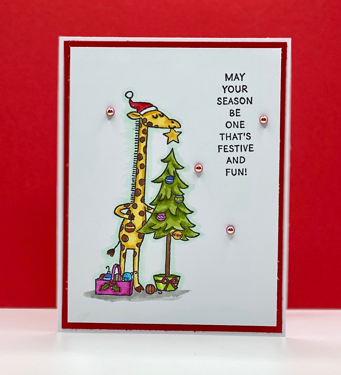 Stampin' Up!'s Festive & Fun stamps with giraffe and Christmas tree colored with many Stampin' Blends markers and white and red base papers