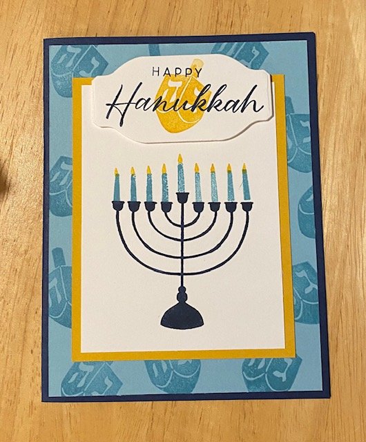 Navy and gold Celebrate the Miracle Hanukkah card with menorah and candles and dreidls