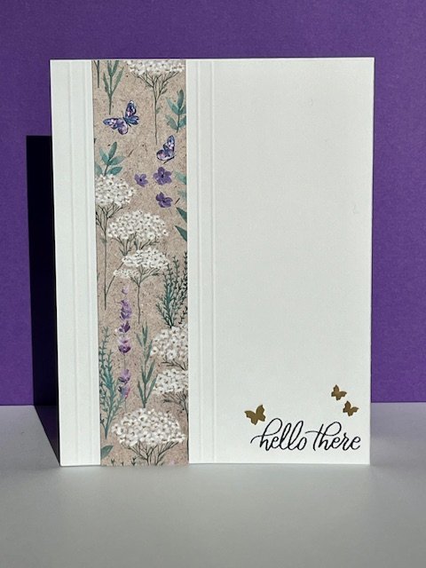 Stampin' Up! white card with Perennial Lavendar DSP strip framed with embossed stripes and hello there message