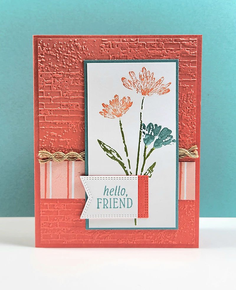 Stampin' Up! Inked and Tiled stamp set used to make coral, teal and green card with hello friend sentiment and dry embossed background