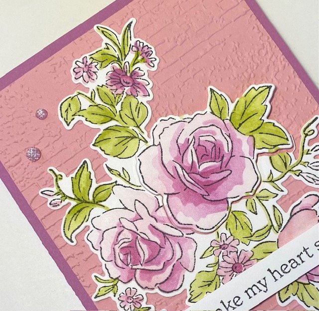 stampin' up! layers of beauty bundle with pink/purple flowers and green leaves