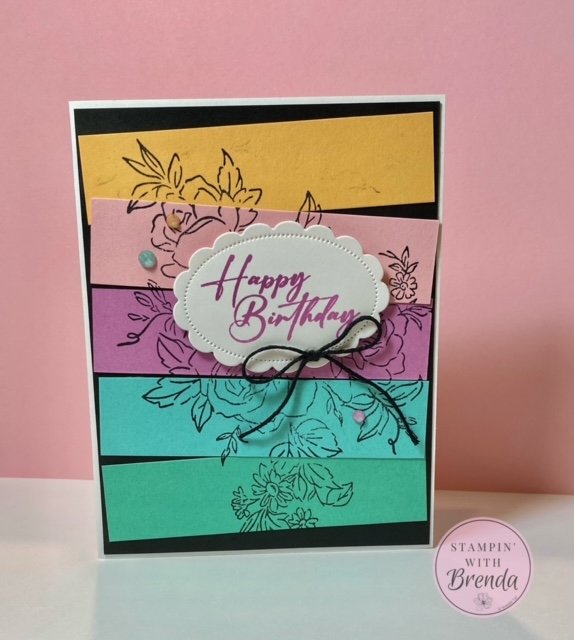 stampin' up! In Color card with strips of new in color cardstock on black background, stamped with floral image from layers of beauty stamp set and happy birthday label
